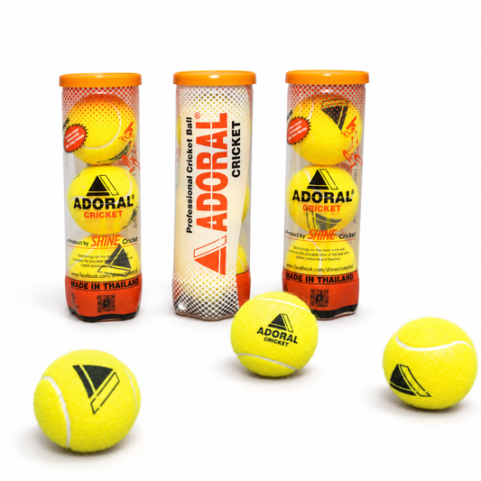 Adoral yellow cricket balls in orange and clear Shine Cricket ball tubes