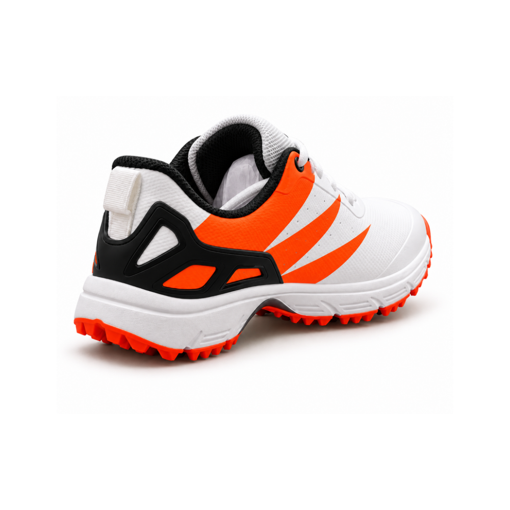 Adoral Jet white and orange cricket shoes with black heel support and orange studded outsole, rear view