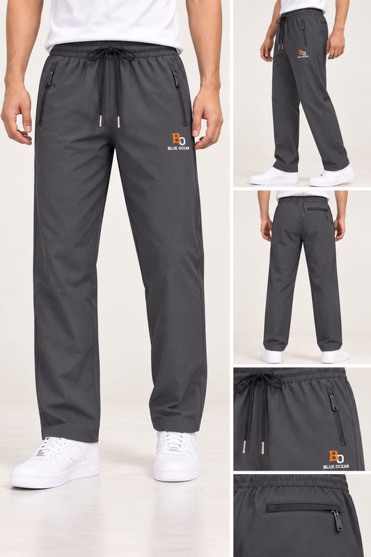 Men's Blue Ocean grey trousers shown on a model from the front and back, with close-ups of the waistband and logo.