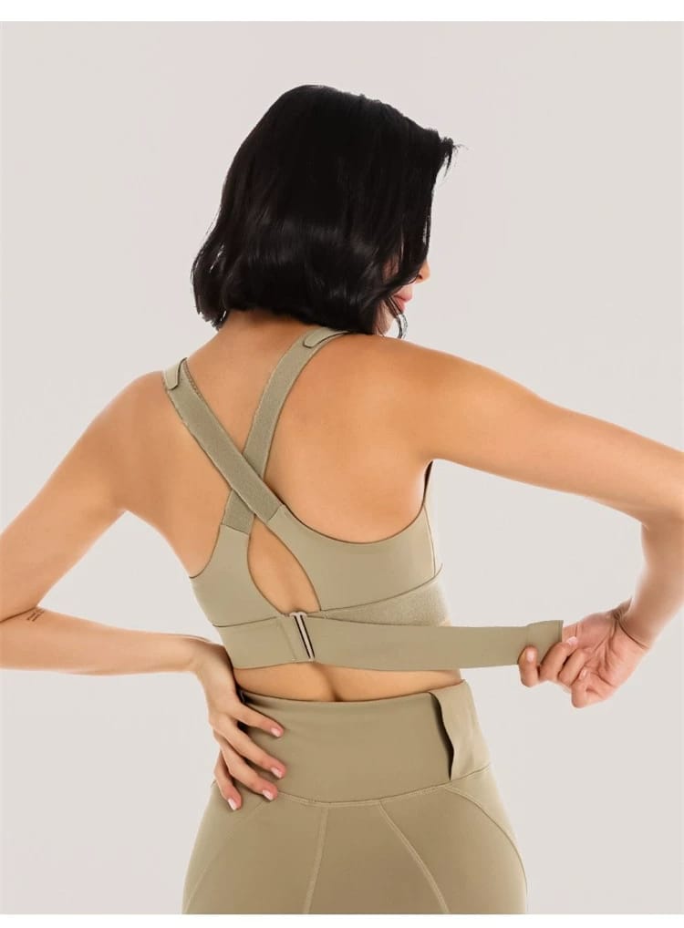 Olive Green Front: Olive green women's front-zip sports bra with adjustable shoulder straps, front view.